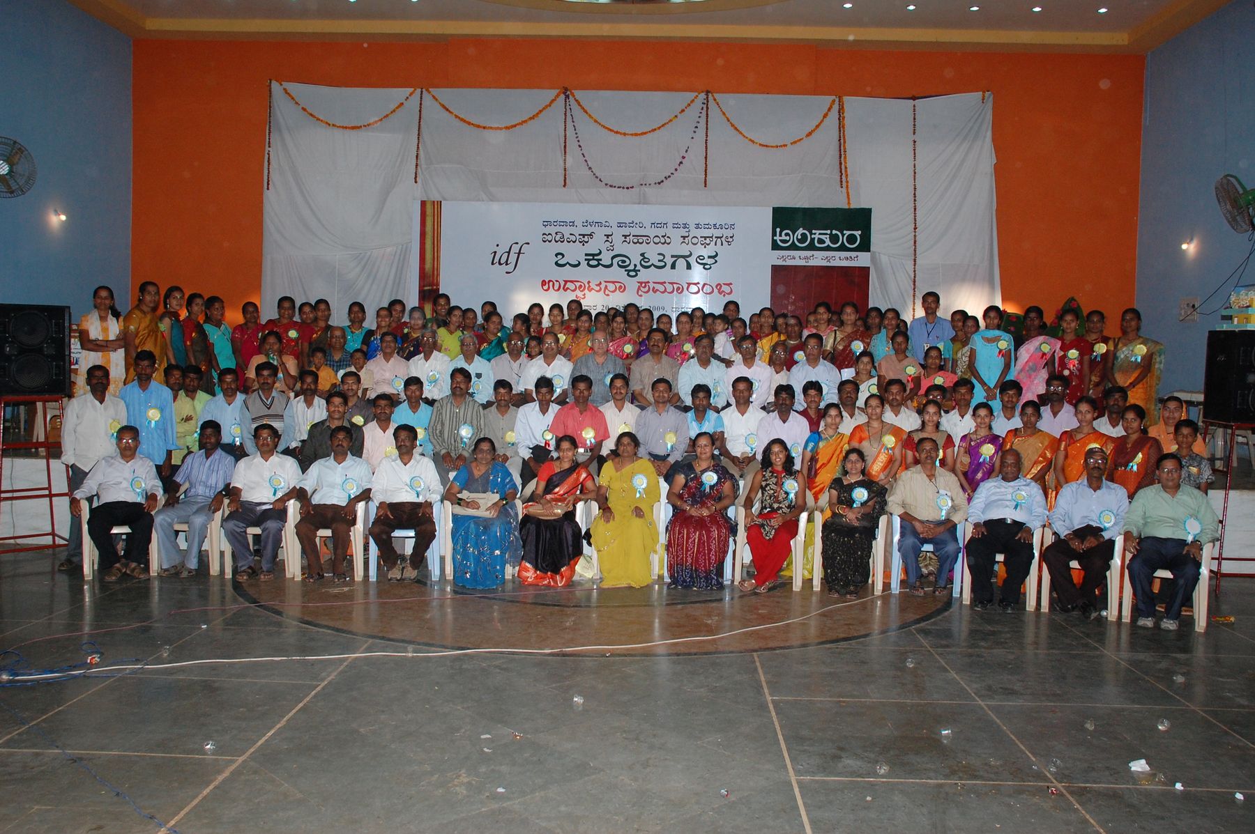 Members of community federations gathered in a hall