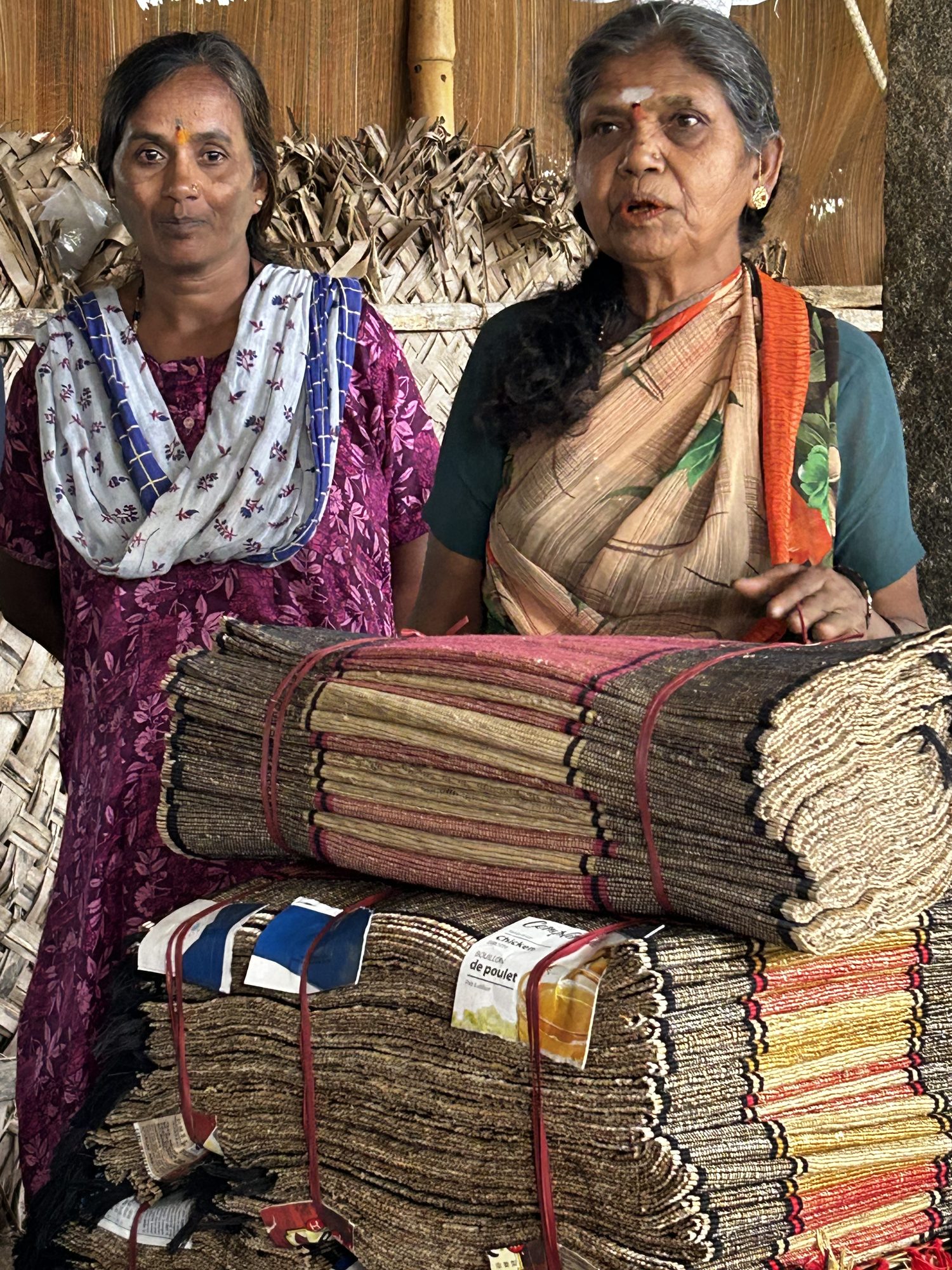 Women members with stacked produce bags